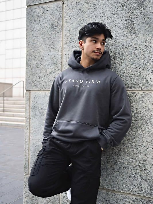 Model wearing Granite Gray Armor of God premium heavyweight hoodie
