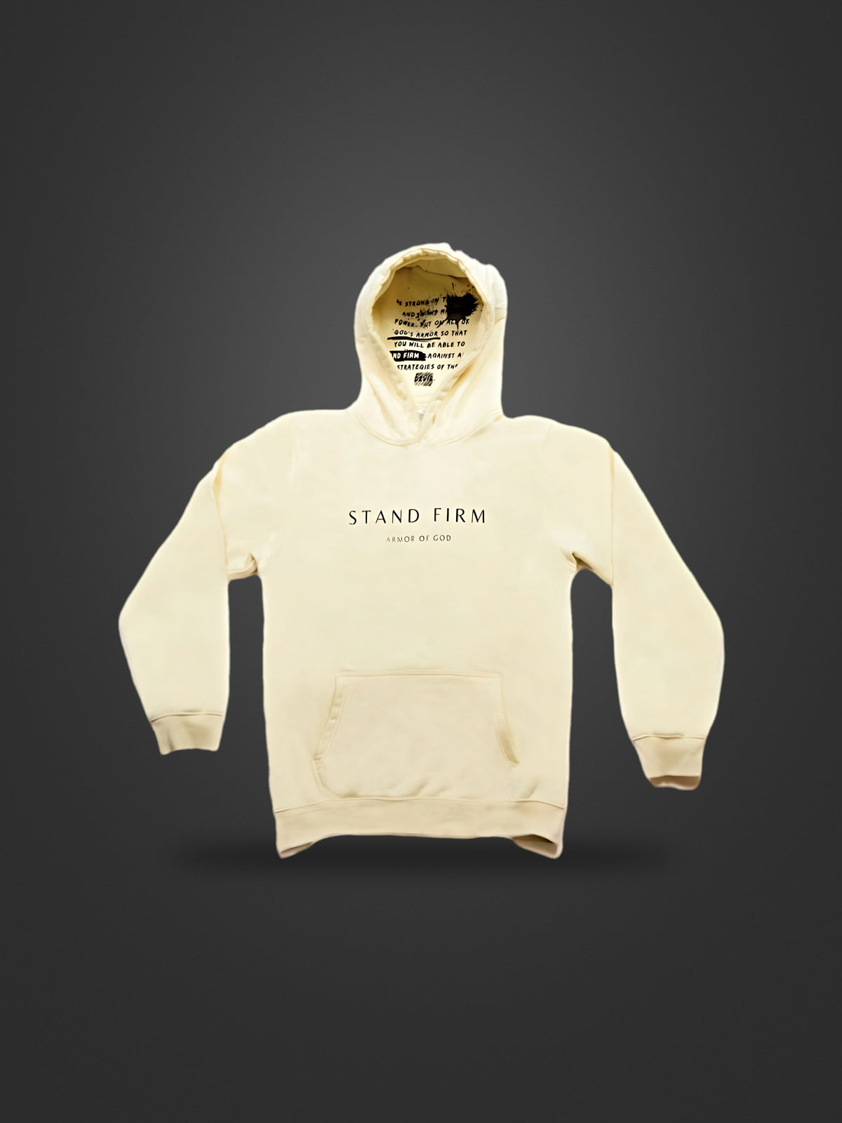 Cream premium heavyweight hoodie, front view on dark background with Stand Firm chest print and verse inside the hood