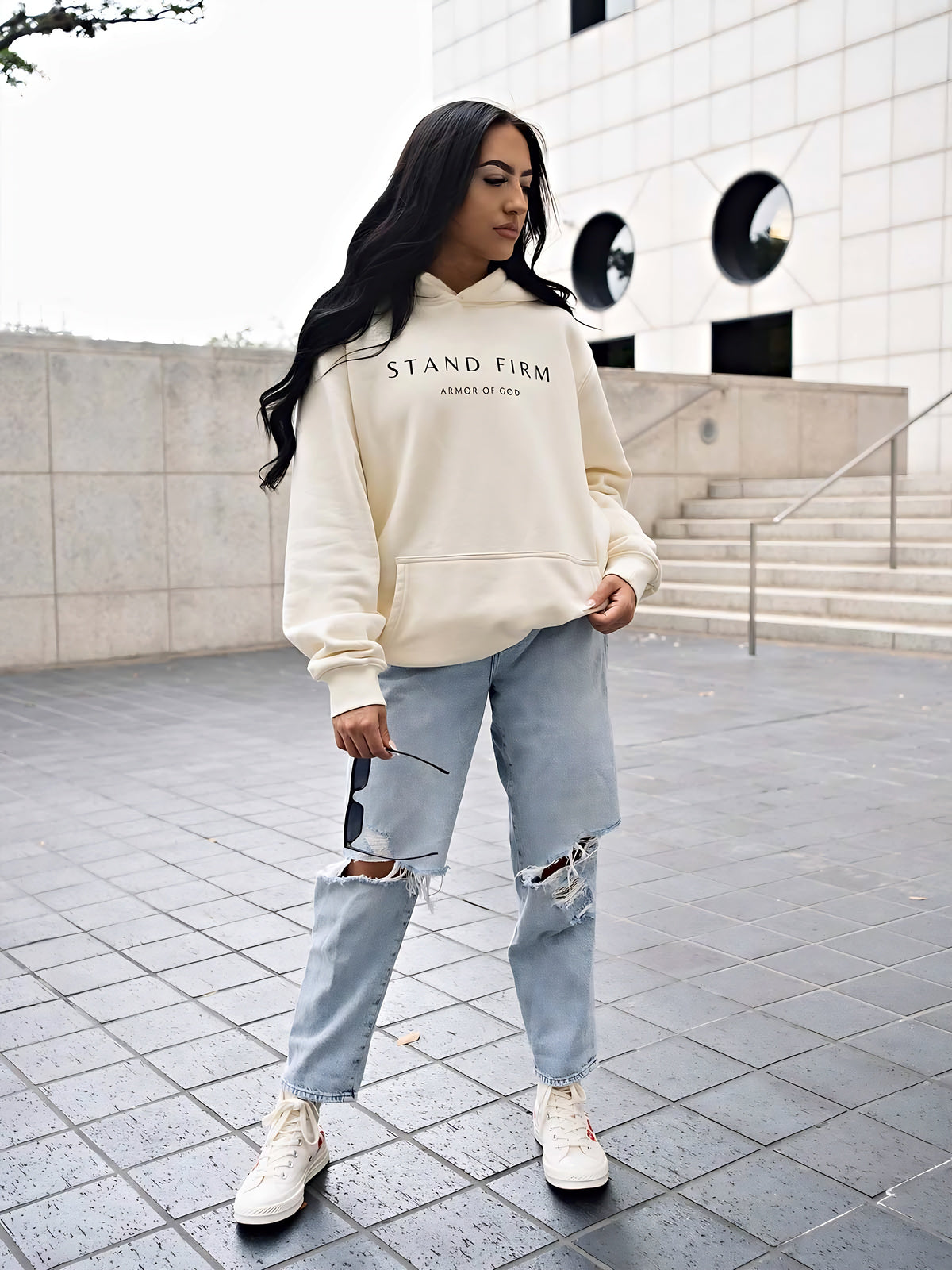 Model wearing Cream Armor of God premium heavyweight hoodie