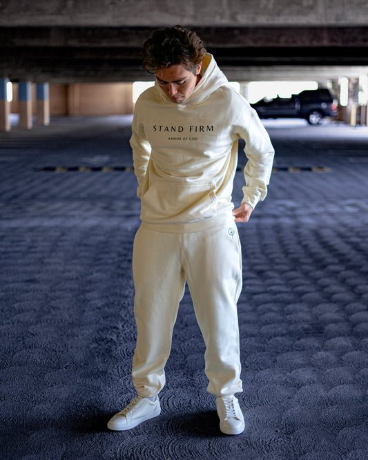 Model wearing Cream Armor of God premium heavyweight hoodie