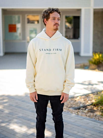 Model wearing cream Yahweh hoodie with Stand Firm chest print