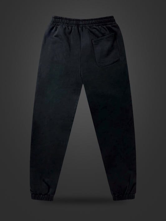 Revelation Black premium heavyweight athleisure joggers, rear view on dark background