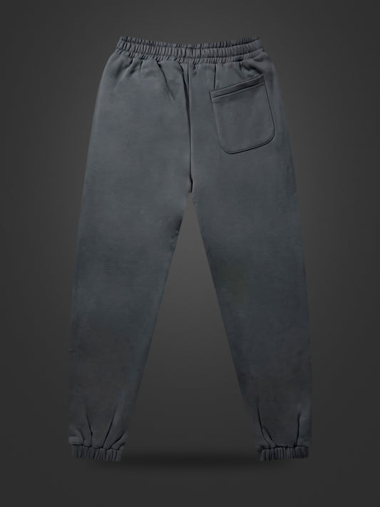 Gray premium heavyweight athleisure joggers, rear view on dark background